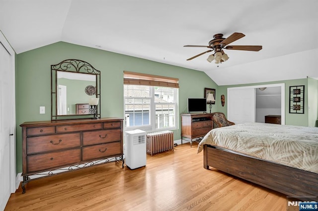74 Bartholdi Ave, Butler Borough, NJ 07405 - bedroom featuring radiator heating unit, vaulted ceiling, light wood-style flooring, and ceiling fan