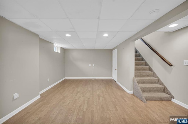74 Bartholdi Ave, Butler Borough, NJ 07405 - basement with wood finished floors, a drop ceiling, stairs, and recessed lighting