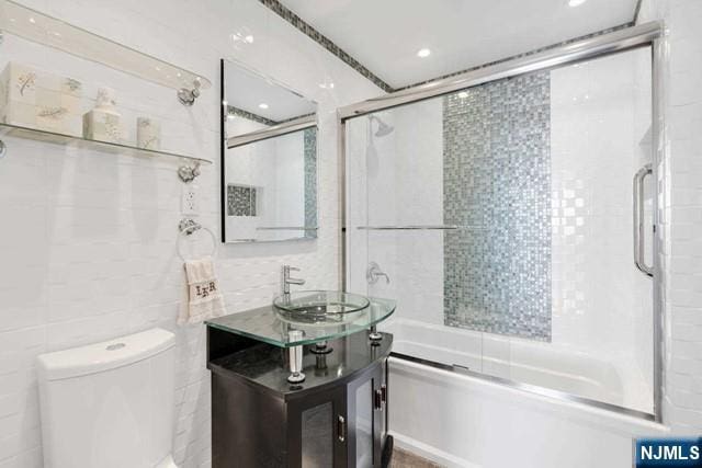 1600 Parker Ave Unit 1G, Fort Lee, NJ 07024 - bathroom featuring bath / shower combo with glass door and vanity