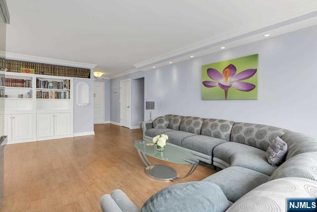 1600 Parker Ave Unit 1G, Fort Lee, NJ 07024 - living area featuring wood finished floors, recessed lighting, and ornamental molding