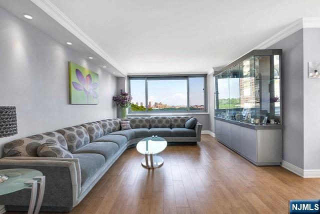 1600 Parker Ave Unit 1G, Fort Lee, NJ 07024 - living room with wood finished floors, crown molding, and recessed lighting
