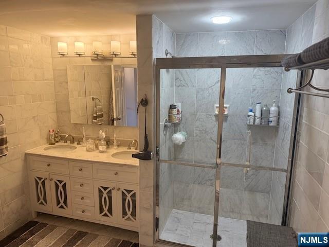 900 Palisade Unit 1-J, Fort Lee, NJ 07024 - full bathroom with double vanity and a stall shower