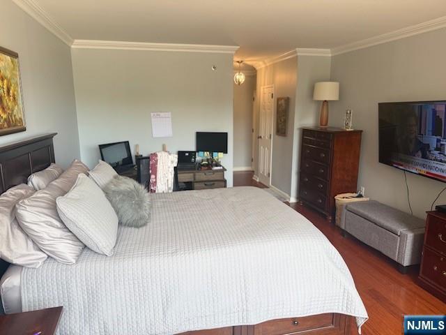900 Palisade Unit 1-J, Fort Lee, NJ 07024 - bedroom with ornamental molding and wood finished floors
