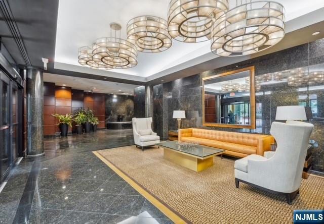 900 Palisade Unit 1-J, Fort Lee, NJ 07024 - building lobby featuring tile walls