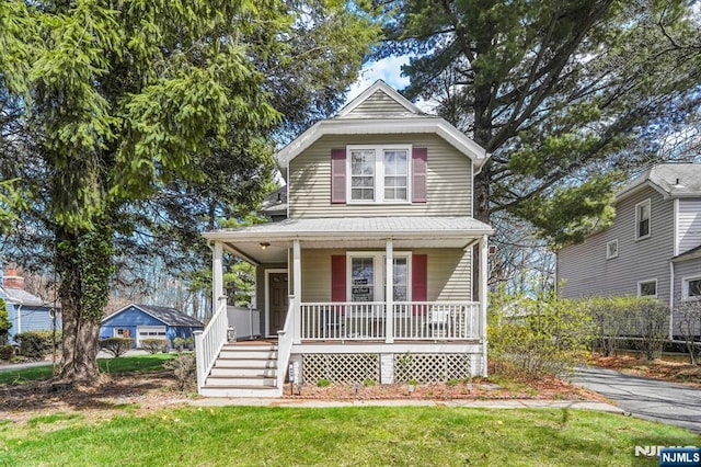 699 Riverview Dr, Totowa, NJ 07512 - view of front of property featuring covered porch and a front lawn