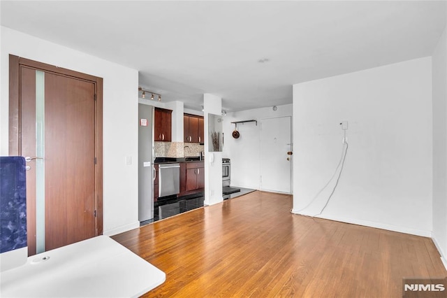 500 Linwood Dr Unit 5H, Fort Lee, NJ 07024 - unfurnished living room with wood finished floors and baseboards