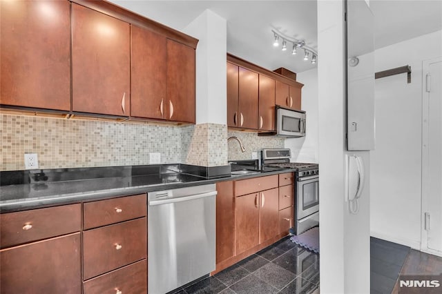 500 Linwood Dr Unit 5H, Fort Lee, NJ 07024 - kitchen with stainless steel appliances, dark countertops, decorative backsplash, and granite tiled floors