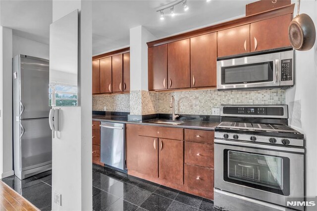 500 Linwood Dr Unit 5H, Fort Lee, NJ 07024 - kitchen with stainless steel appliances, dark countertops, granite tiled floors, and backsplash