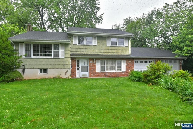 50 Grove St, Waldwick, NJ 07463 - tri-level home with an attached garage, a chimney, and a front lawn