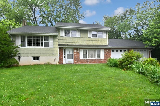 50 Grove St, Waldwick, NJ 07463 - split level home with an attached garage, a front lawn, and a chimney