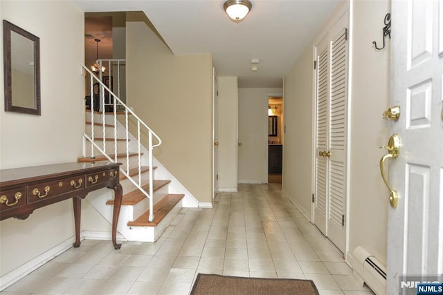 50 Grove St, Waldwick, NJ 07463 - entryway with light tile patterned floors, a baseboard heating unit, and stairway