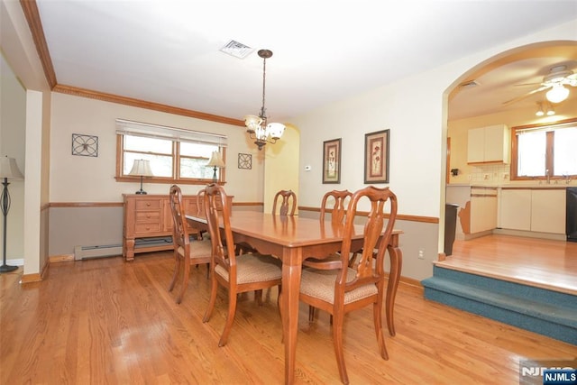 50 Grove St, Waldwick, NJ 07463 - dining room with light wood-style floors, ceiling fan, plenty of natural light, baseboard heating, and ornamental molding