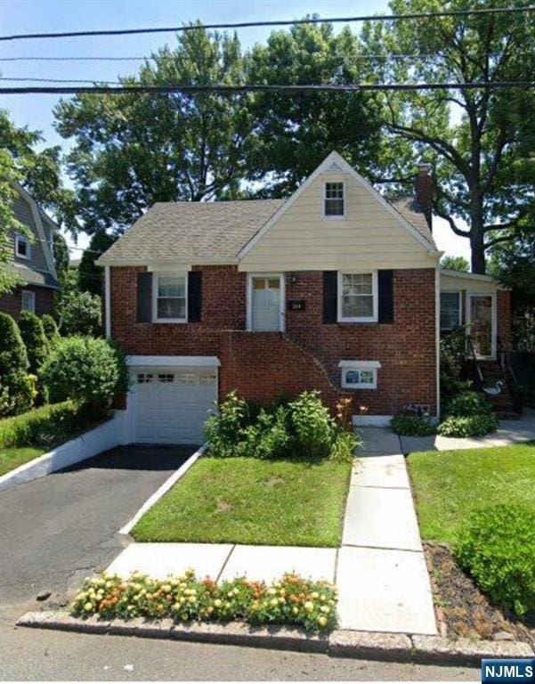 264 Beverly Hills Rd, Fort Lee, NJ 07024 - view of front of property featuring brick siding, an attached garage, a chimney, driveway, and a front lawn