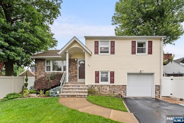 37 Furber Ave, Linden, NJ 07036 - split level home with stone siding, a garage, and driveway