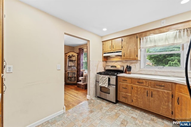 37 Furber Ave, Linden, NJ 07036 - kitchen with range with two ovens, under cabinet range hood, light countertops, recessed lighting, and decorative backsplash