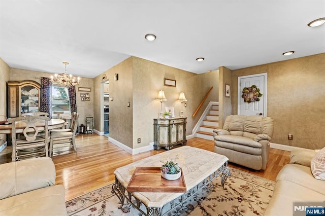 37 Furber Ave, Linden, NJ 07036 - living room featuring a chandelier, light wood finished floors, stairway, and recessed lighting
