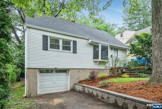 97 Palisade Ave, Leonia, NJ 07605 - view of front of property with an attached garage, a shingled roof, and driveway