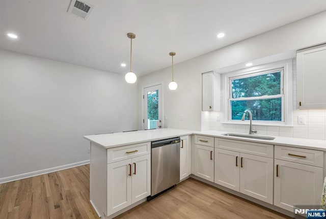 97 Palisade Ave, Leonia, NJ 07605 - kitchen featuring dishwasher, a peninsula, tasteful backsplash, light wood-style floors, and recessed lighting