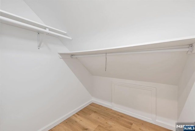 97 Palisade Ave, Leonia, NJ 07605 - walk in closet with light wood-type flooring and lofted ceiling