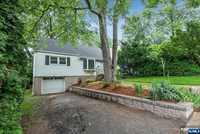 97 Palisade Ave, Leonia, NJ 07605 - view of front of property with asphalt driveway, an attached garage, and a shingled roof