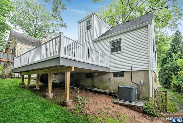 97 Palisade Ave, Leonia, NJ 07605 - rear view of property featuring a deck, a lawn, and roof with shingles