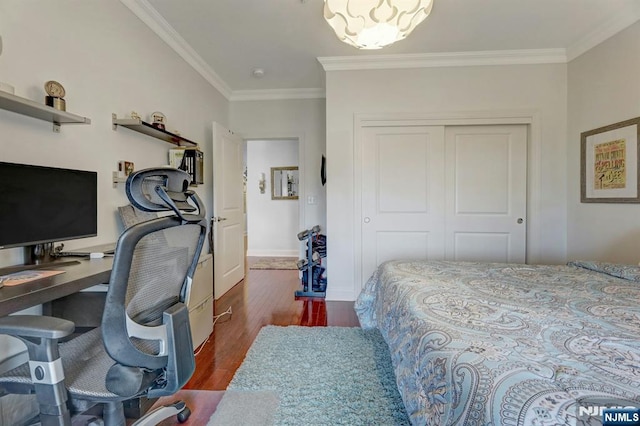 20 Ave At Port Imperial 425, West New York, NJ 07093 - bedroom with ornamental molding, a closet, wood finished floors, and a desk