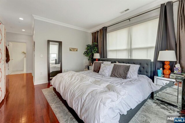 20 Ave At Port Imperial 425, West New York, NJ 07093 - bedroom featuring ornamental molding, dark wood finished floors, and recessed lighting