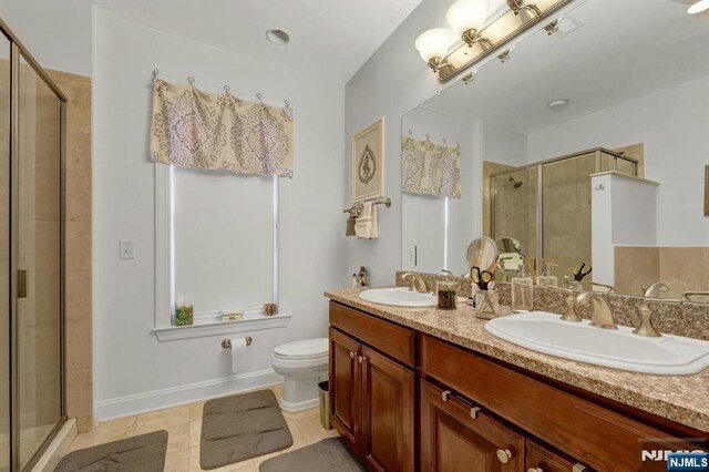 20 Ave At Port Imperial 425, West New York, NJ 07093 - full bath featuring a shower stall, double vanity, and tile patterned floors