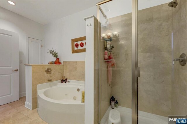 20 Ave At Port Imperial 425, West New York, NJ 07093 - full bathroom with a stall shower, a whirlpool tub, and tile patterned floors
