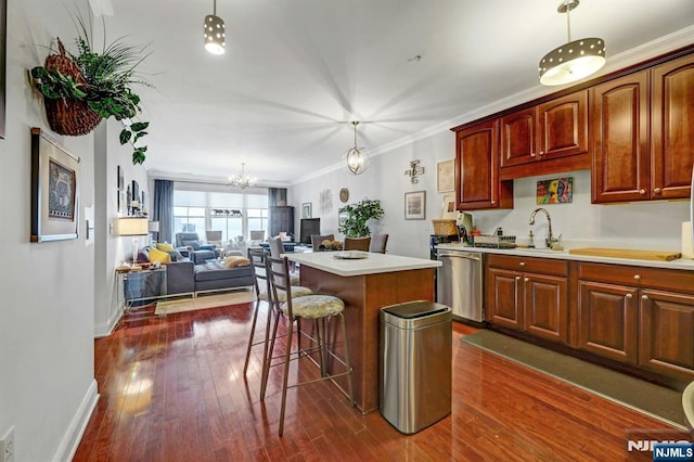 20 Ave At Port Imperial 425, West New York, NJ 07093 - kitchen with stainless steel dishwasher, a center island, a chandelier, a breakfast bar, and dark wood finished floors