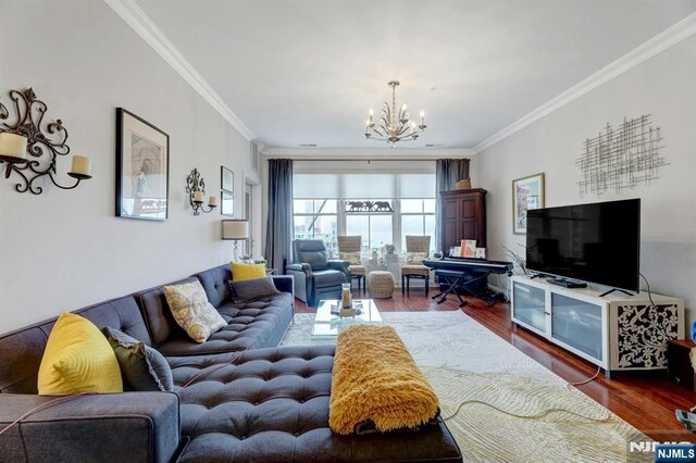 20 Ave At Port Imperial 425, West New York, NJ 07093 - living area featuring a chandelier, wood finished floors, and ornamental molding