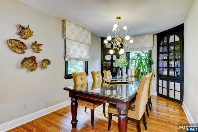 99 Chestnut Dr, Wayne, NJ 07470 - dining space featuring a chandelier and wood finished floors