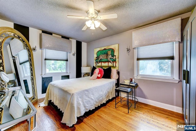 99 Chestnut Dr, Wayne, NJ 07470 - bedroom featuring wood finished floors, a textured ceiling, and a ceiling fan
