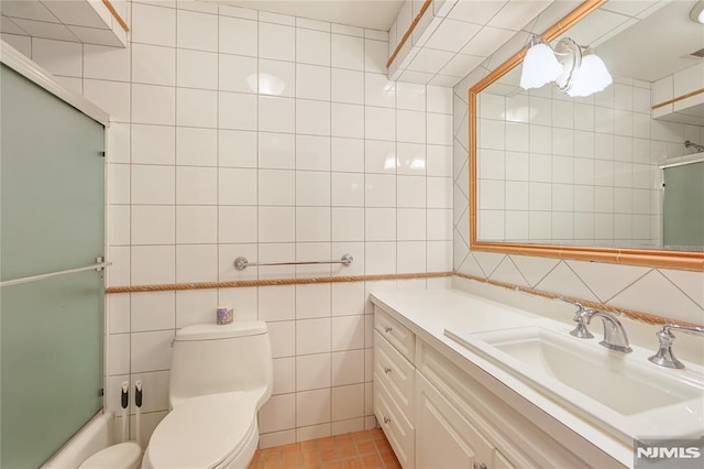 2171 Ellery Ave Unit A, Fort Lee, NJ 07024 - full bath featuring tile walls, vanity, and bath / shower combo with glass door