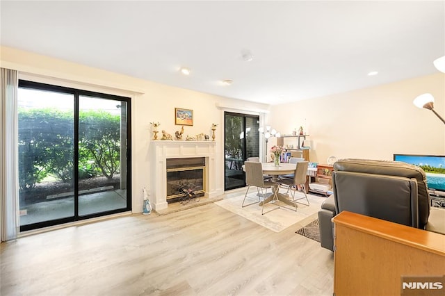 2171 Ellery Ave Unit A, Fort Lee, NJ 07024 - living area with light wood-style floors, a glass covered fireplace, and recessed lighting