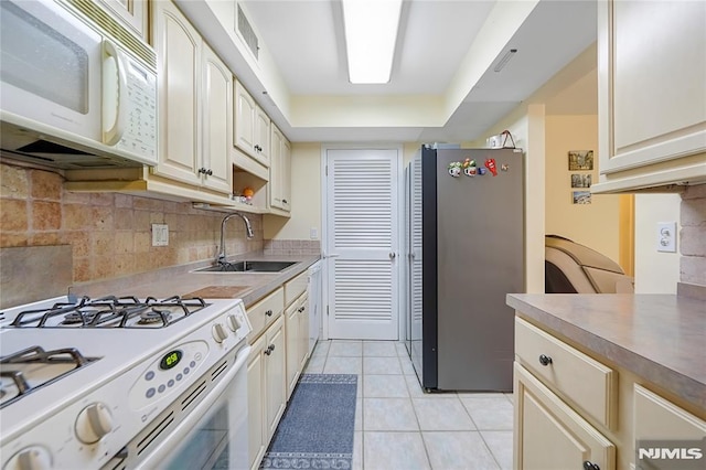 2171 Ellery Ave Unit A, Fort Lee, NJ 07024 - kitchen featuring white appliances, light tile patterned flooring, backsplash, and light countertops
