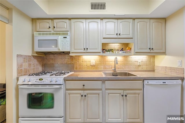 2171 Ellery Ave Unit A, Fort Lee, NJ 07024 - kitchen featuring white appliances, light countertops, decorative backsplash, and cream cabinets
