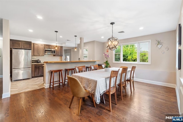 37 Golf Ct, Teaneck, NJ 07666 - dining space featuring dark wood-type flooring, recessed lighting, and a chandelier