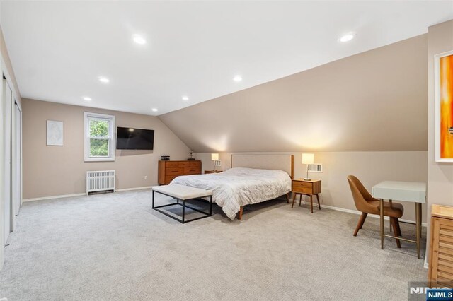 37 Golf Ct, Teaneck, NJ 07666 - bedroom with radiator, light carpet, lofted ceiling, recessed lighting, and an office area