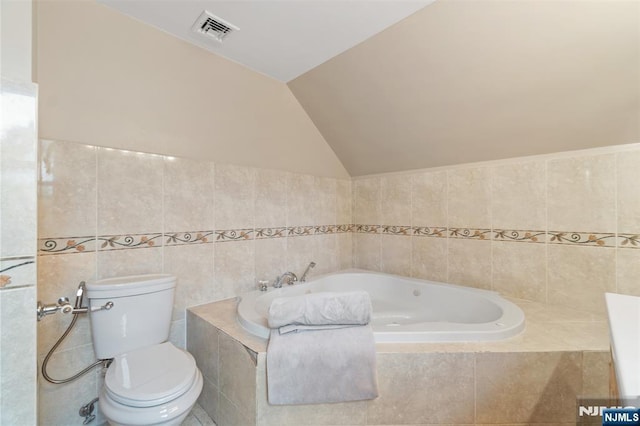 37 Golf Ct, Teaneck, NJ 07666 - bathroom with a bath, lofted ceiling, and tile walls