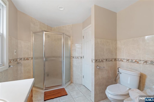 37 Golf Ct, Teaneck, NJ 07666 - bathroom featuring tile walls, vanity, a stall shower, and tile patterned floors