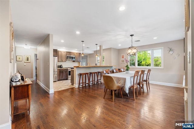 37 Golf Ct, Teaneck, NJ 07666 - dining area with dark wood-type flooring and recessed lighting