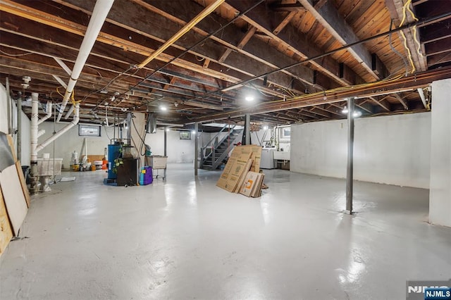 37 Golf Ct, Teaneck, NJ 07666 - basement with stairway, water heater, and separate washer and dryer