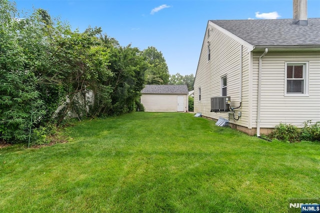 37 Golf Ct, Teaneck, NJ 07666 - view of green lawn with an outbuilding