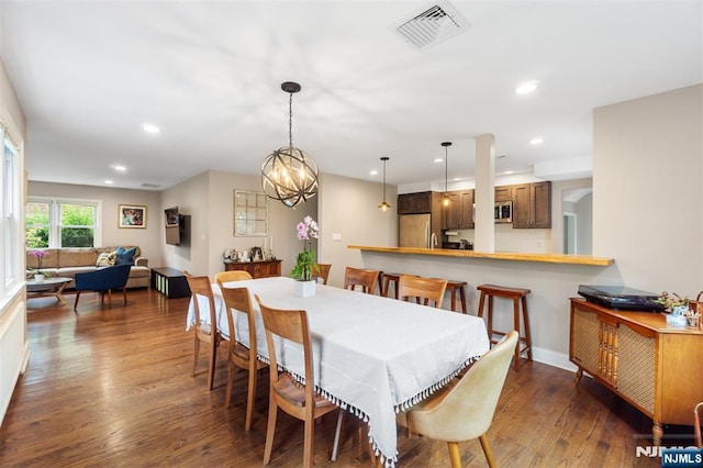 37 Golf Ct, Teaneck, NJ 07666 - dining space featuring dark wood-type flooring, recessed lighting, and a chandelier