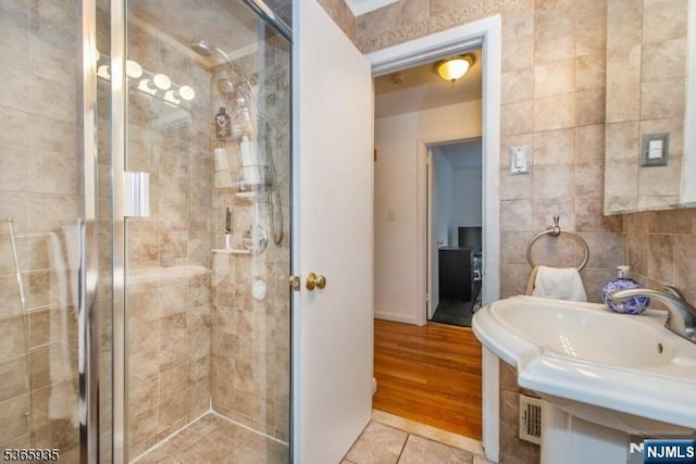 362 Valley Rd, Wayne, NJ 07470 - full bath with a stall shower, tile patterned floors, and tile walls