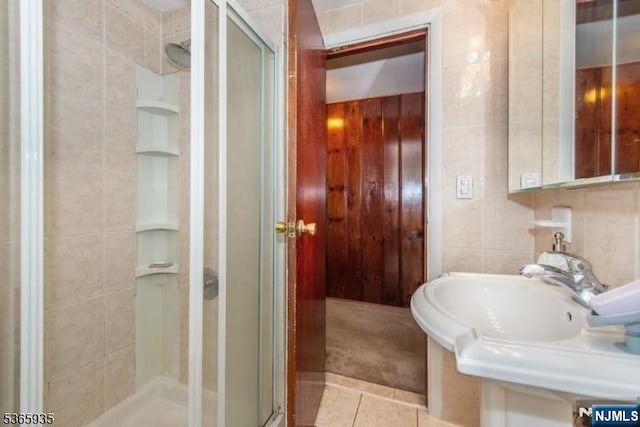 362 Valley Rd, Wayne, NJ 07470 - full bathroom featuring a shower stall, tile walls, and tile patterned floors