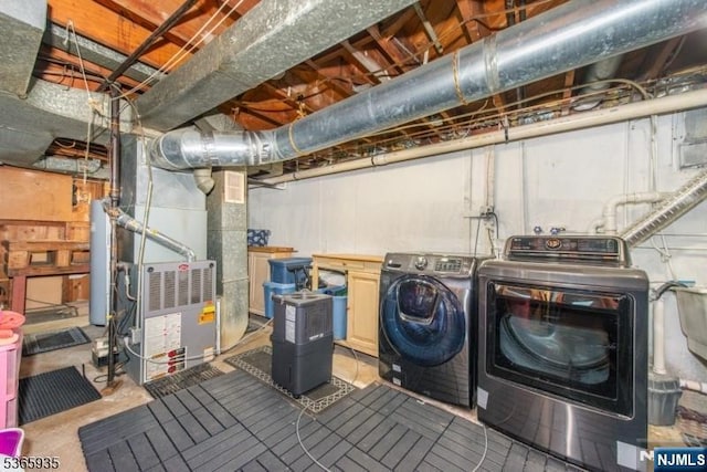 362 Valley Rd, Wayne, NJ 07470 - unfinished below grade area featuring separate washer and dryer, heating unit, and gas water heater