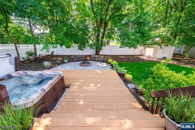 362 Valley Rd, Wayne, NJ 07470 - wooden terrace with a fenced backyard, an outdoor hot tub, and a storage unit