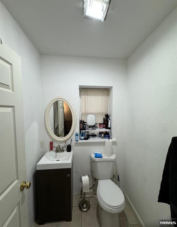 202 Harrison St, Paterson, NJ 07501 - half bathroom featuring tile patterned flooring and vanity